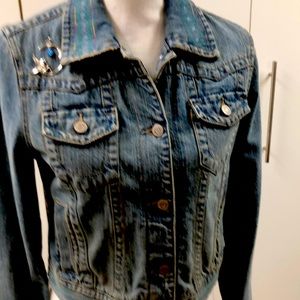 A custom embroidered jacket measures 15” across the back and is one of a kind.